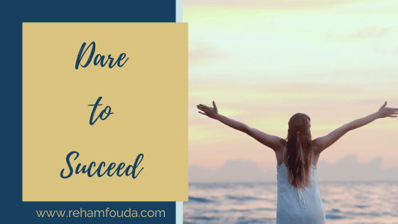 Dare to Succeed by Reham Fouda, a young woman standing in front of the sea and celebrate success